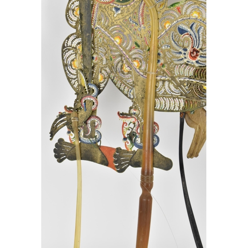 76 - Two late 19th/early 20th century Indonesian Wayang shadow puppets, to include one made of wood with ... 