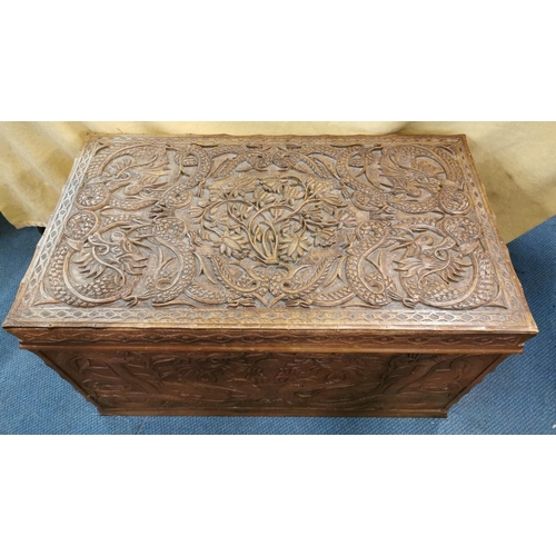 84 - An early 20th century Chinese camphor chest, with carved dragon design to the lid and sides, the fro... 