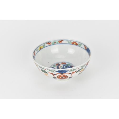 24 - A Chinese wucai porcelain 'immortals' bowl, with doucai decoration of underglazed blue and applied e... 