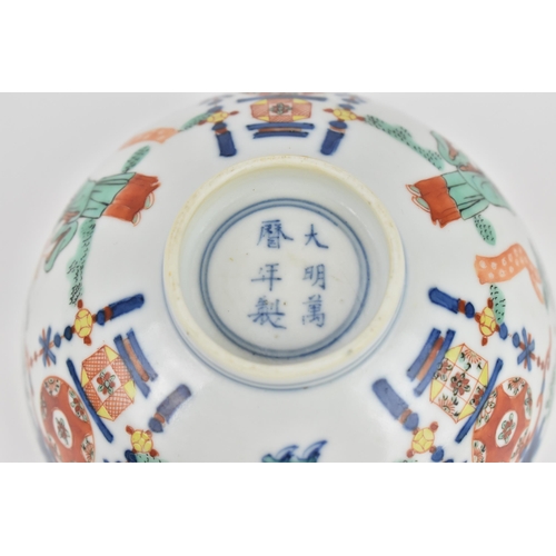 24 - A Chinese wucai porcelain 'immortals' bowl, with doucai decoration of underglazed blue and applied e... 