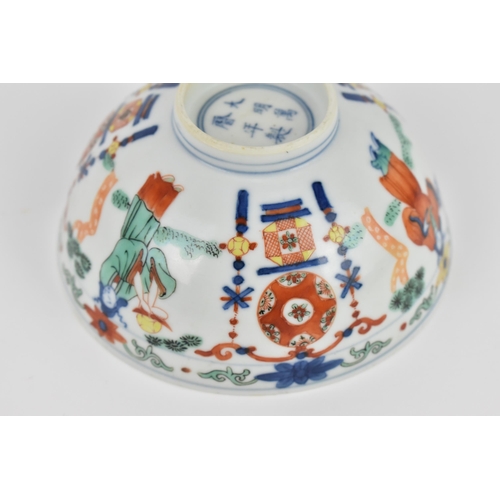 24 - A Chinese wucai porcelain 'immortals' bowl, with doucai decoration of underglazed blue and applied e... 