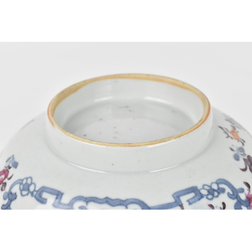 41 - A Chinese 18th century export porcelain bowl, designed with underglazed blue and hand painted floral... 