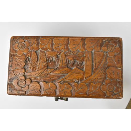 42 - Two Chinese carved camphor wood boxes, the larger one with carved landscapes and figures in bamboo s... 