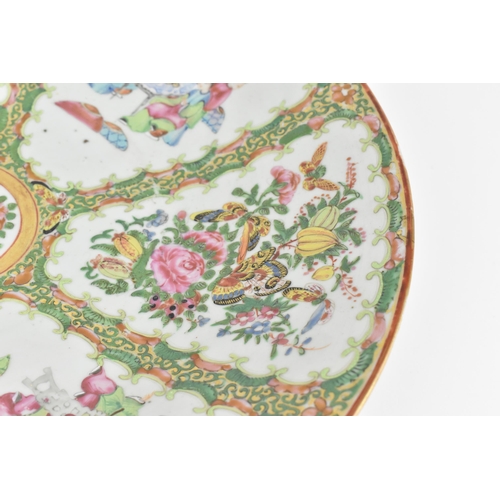 48 - A large Chinese Canton export porcelain charger, 19th century, in the famille rose palette, of circu... 