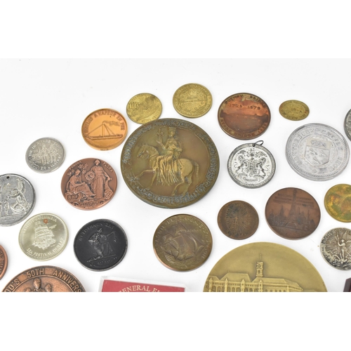 116 - A collection of assorted commemorative medals to include a medal commemorating the opening of St Nic... 