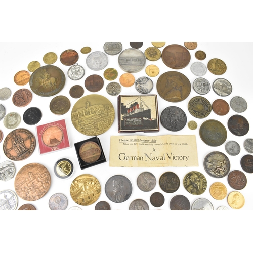 116 - A collection of assorted commemorative medals to include a medal commemorating the opening of St Nic... 