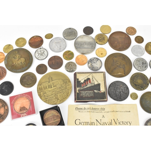 116 - A collection of assorted commemorative medals to include a medal commemorating the opening of St Nic... 