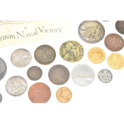 116 - A collection of assorted commemorative medals to include a medal commemorating the opening of St Nic... 