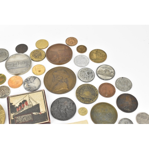 116 - A collection of assorted commemorative medals to include a medal commemorating the opening of St Nic... 