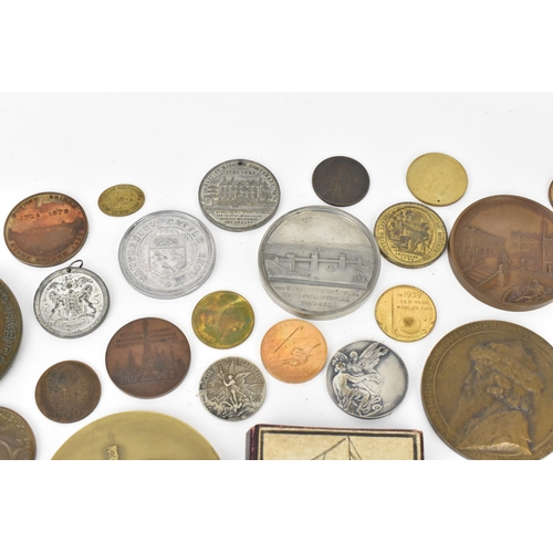 116 - A collection of assorted commemorative medals to include a medal commemorating the opening of St Nic... 