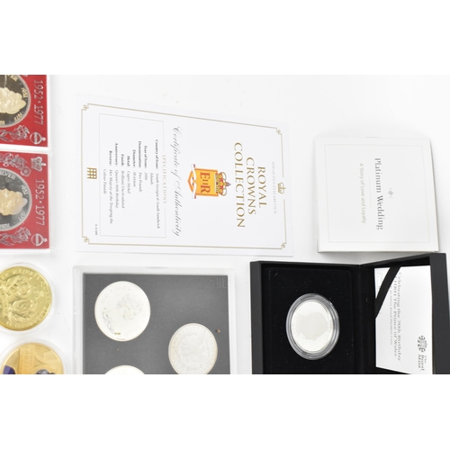 121 - A collection of Queen Elizabeth II and Royal related commemorative coins to include the Royal Canadi... 