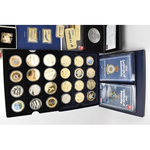 123 - A collection of Royal Mint and other commemorative coins of WWII and RAF interest to include the 24c... 