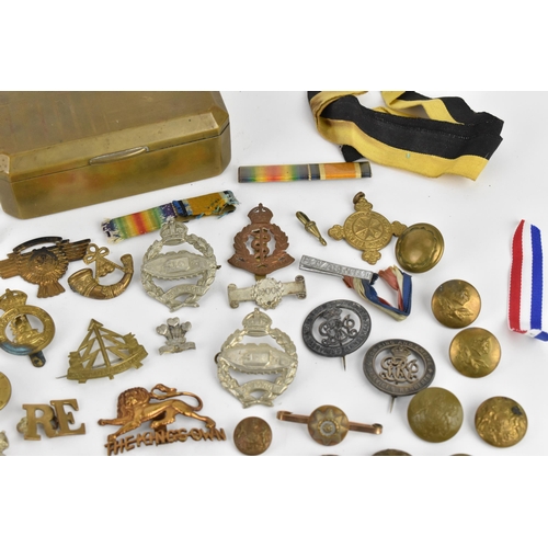 142 - First World War and later cap badges, medal bars and mixed buttons to include Royal Tank Corps, The ... 