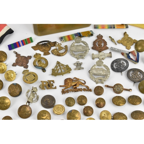 142 - First World War and later cap badges, medal bars and mixed buttons to include Royal Tank Corps, The ... 