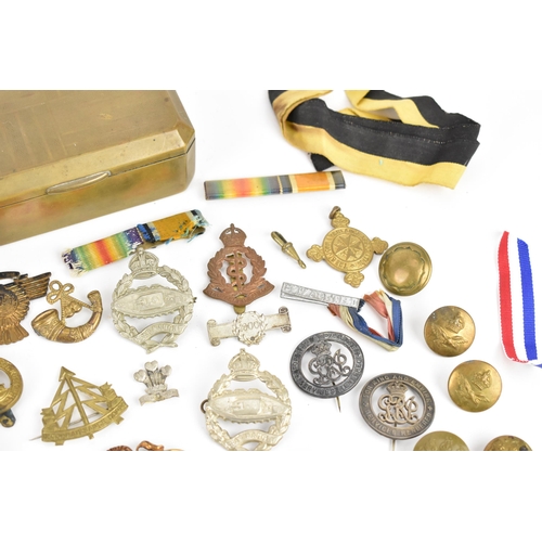 142 - First World War and later cap badges, medal bars and mixed buttons to include Royal Tank Corps, The ... 