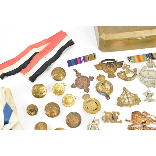 142 - First World War and later cap badges, medal bars and mixed buttons to include Royal Tank Corps, The ... 