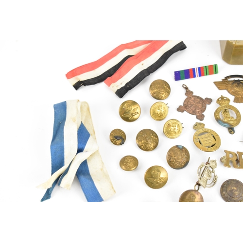 142 - First World War and later cap badges, medal bars and mixed buttons to include Royal Tank Corps, The ... 