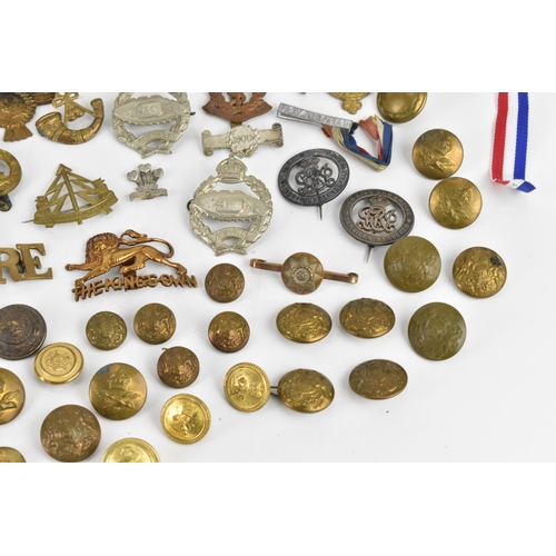 142 - First World War and later cap badges, medal bars and mixed buttons to include Royal Tank Corps, The ... 