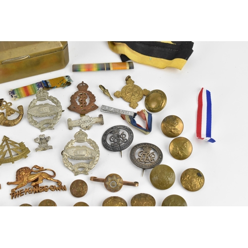 142 - First World War and later cap badges, medal bars and mixed buttons to include Royal Tank Corps, The ... 