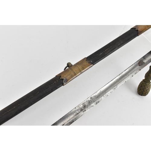 158 - An 1827 pattern Royal Navy Officers sword and scabbard having lion head pommel and folding guard, wi... 