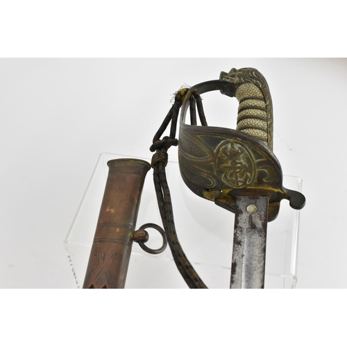 158 - An 1827 pattern Royal Navy Officers sword and scabbard having lion head pommel and folding guard, wi... 