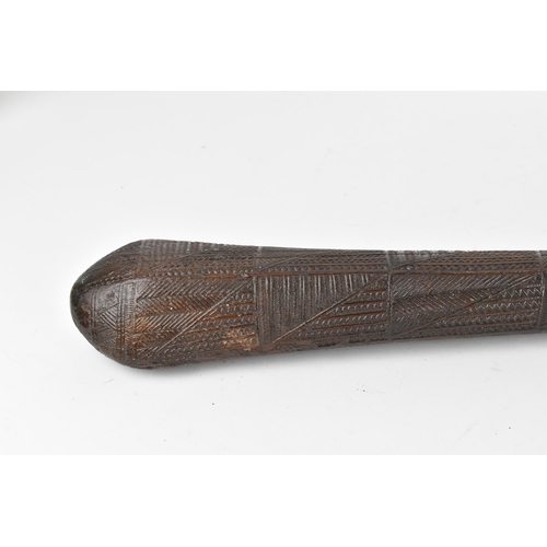 186 - A tribal Polynesian Povai Tonga war club, of tapered form with slight faceted sides, intricately car... 