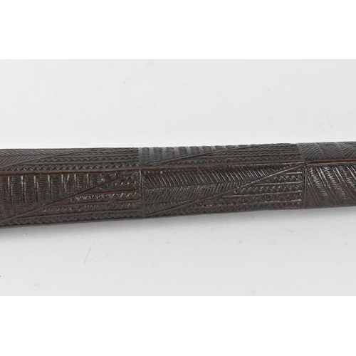 186 - A tribal Polynesian Povai Tonga war club, of tapered form with slight faceted sides, intricately car... 