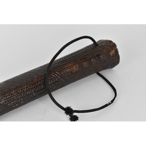 186 - A tribal Polynesian Povai Tonga war club, of tapered form with slight faceted sides, intricately car... 