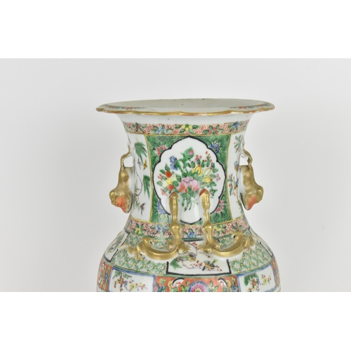 77 - A Chinese Export Famille Rose porcelain baluster vase, Canton, Late 19th/early 20th century, decorat... 