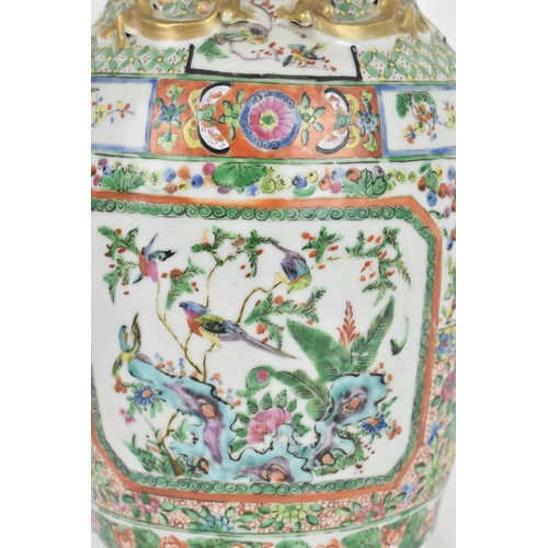 77 - A Chinese Export Famille Rose porcelain baluster vase, Canton, Late 19th/early 20th century, decorat... 