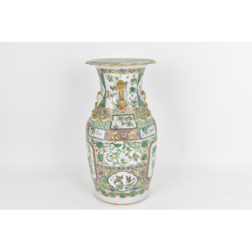 77 - A Chinese Export Famille Rose porcelain baluster vase, Canton, Late 19th/early 20th century, decorat... 