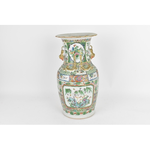 77 - A Chinese Export Famille Rose porcelain baluster vase, Canton, Late 19th/early 20th century, decorat... 