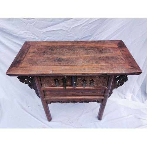 32 - A Chinese late Qing dynasty hardwood altar table, the rectangular top above two central drawers with... 