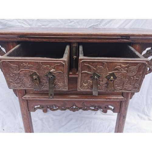 32 - A Chinese late Qing dynasty hardwood altar table, the rectangular top above two central drawers with... 