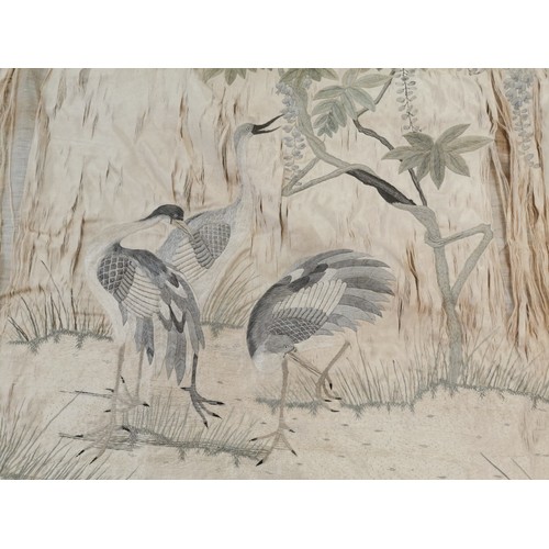 33 - A Japanese Meiji/Taisho period hand embroidered silk panel (unframed loose fabric), depicting herons... 