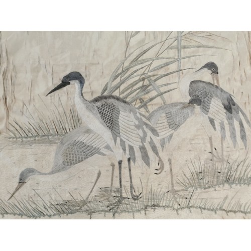 33 - A Japanese Meiji/Taisho period hand embroidered silk panel (unframed loose fabric), depicting herons... 