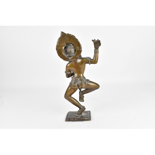 89 - A 19th century or earlier Nepalese bronze sculpture of the deity Vajravarahi, the goddess holding ri... 