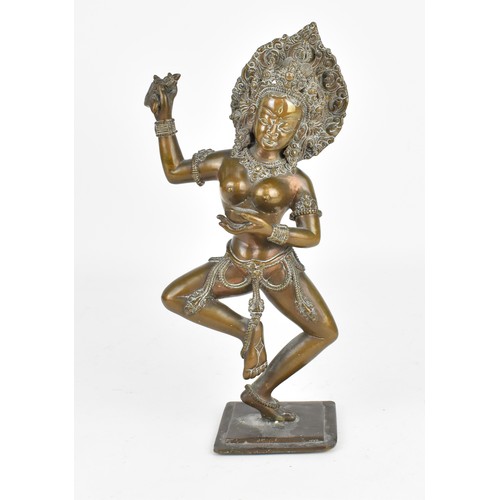 89 - A 19th century or earlier Nepalese bronze sculpture of the deity Vajravarahi, the goddess holding ri... 