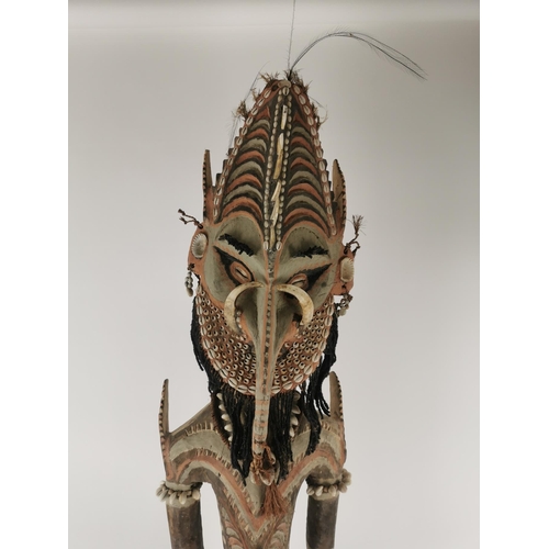 185 - A large tribal Papua New Guinea Iatmul figural wood sculpture, Sepik River, made with boar tusks, ca... 