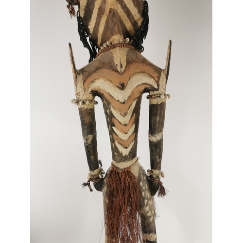 185 - A large tribal Papua New Guinea Iatmul figural wood sculpture, Sepik River, made with boar tusks, ca... 