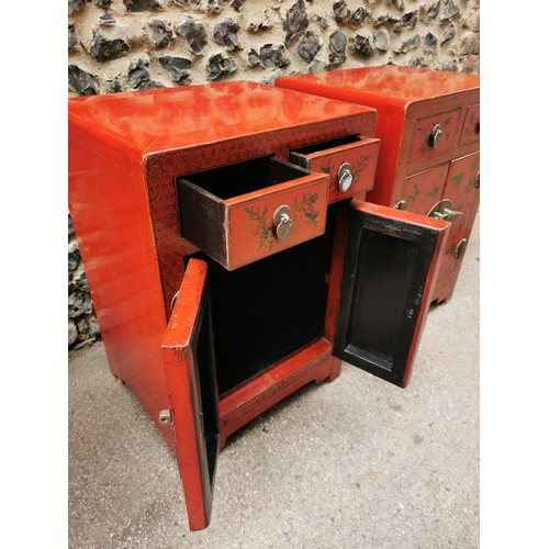 62 - A pair of Chinese red lacquer bedside cabinets, early 20th century, each with two small drawers abov... 