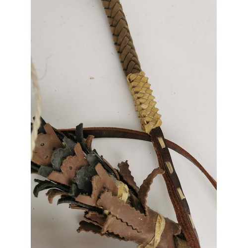 74 - An Oriental martial arts wood and braided leather shaolin whip