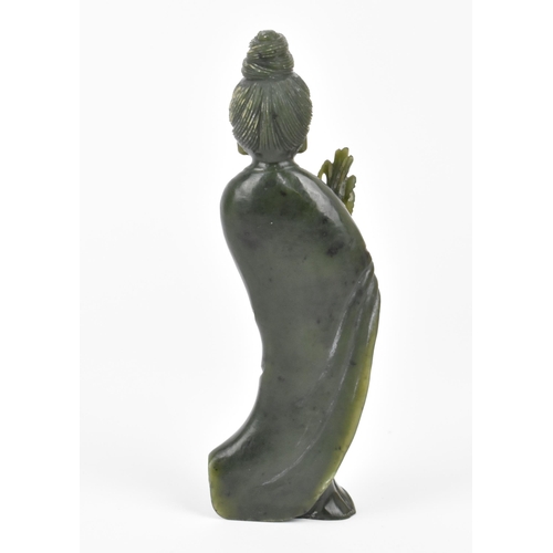 72 - A Chinese Qing dynasty spinach Jade figure of the deity Guanyin in traditional draped clothing, 16.5... 