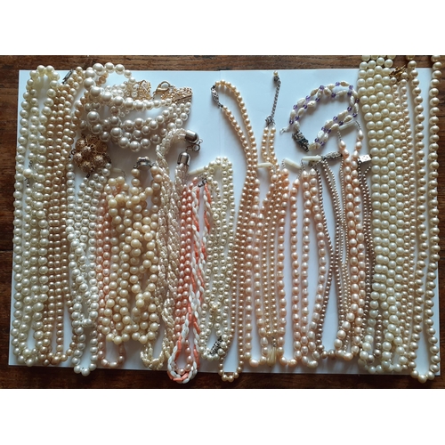 78 - A collection of seed, freshwater and faux pearl necklaces in various lengths, styles and colours. Lo... 