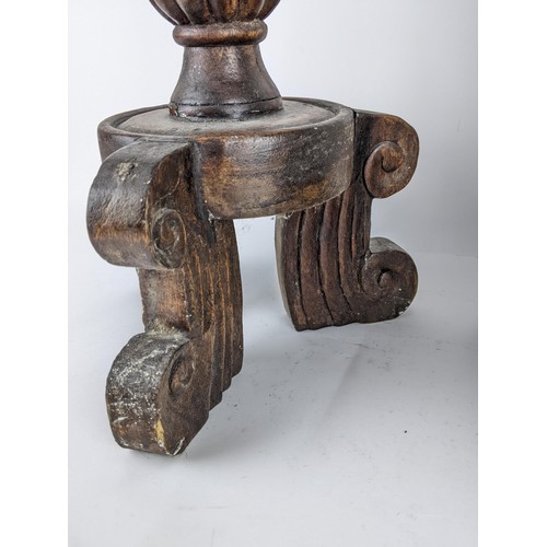 91 - A pair of large late 20th century oak floor standing candlesticks with carved ornament, reeded and a... 