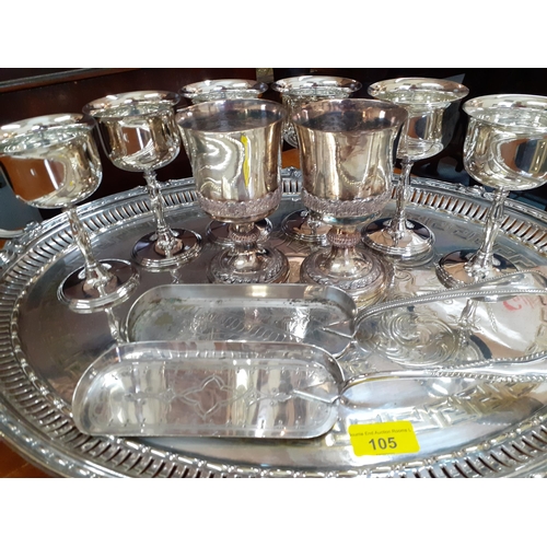 105 - A silver plated twin handled tray with Greek key pattern, together with six silver plated pedestal w... 