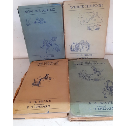 77 - Books to include 4 AA Milne Winnie the Pooh 1934 editions and 2 handwritten books dated 1830 with ve... 