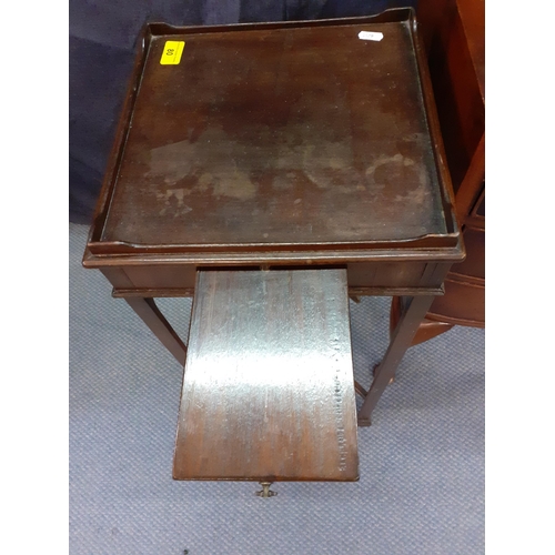 80 - An early 20th century walnut bedside chest of three drawers together with a mahogany occasional tabl... 