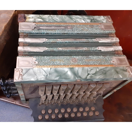 131 - An early 20th Century concertina in green having an art Deco design. Location:1:3