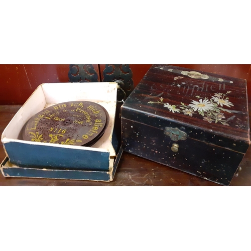 132 - A polyphon music box and 12 discs. Location:1:3